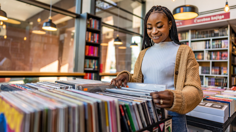woman looking at vinyls instore 