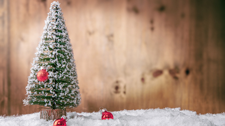 Fake snow covering fake tree and table