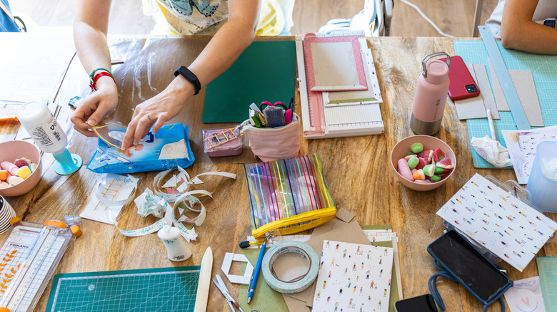 people crafting DIYs on a table