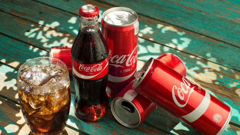 Coca-Cola bottles, Coca-cola cans, ice