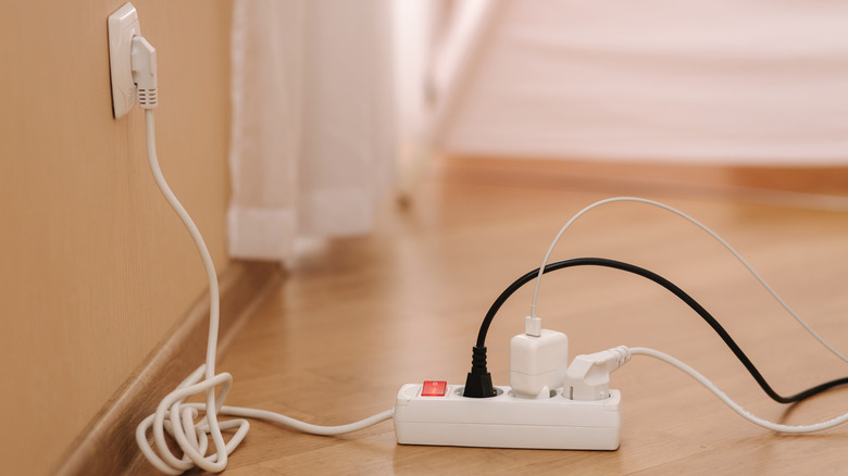 white power cord on floor