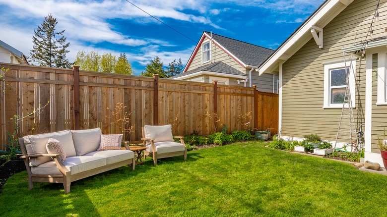 fenced backyard of suburban house