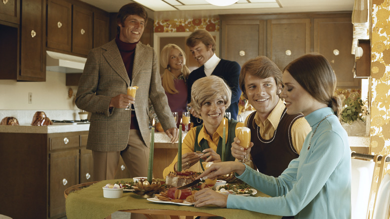 People in a 1970s kitchen