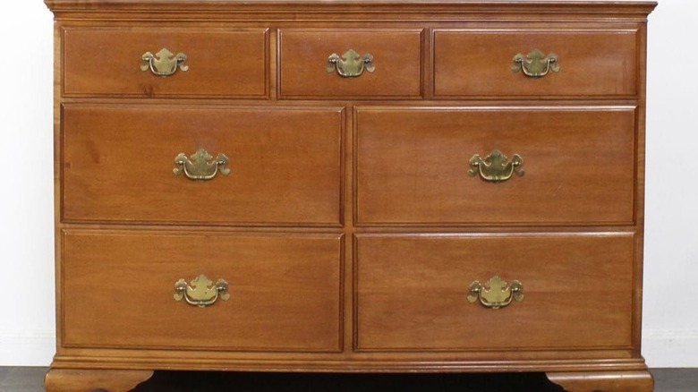 Brown 1970s Colonial revival dresser with batwing pulls