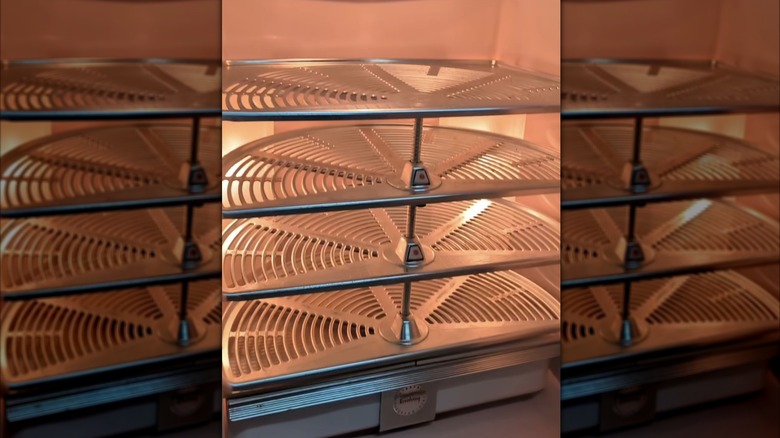 Rotating shelves on the interior of a refrigerator from the 1950s
