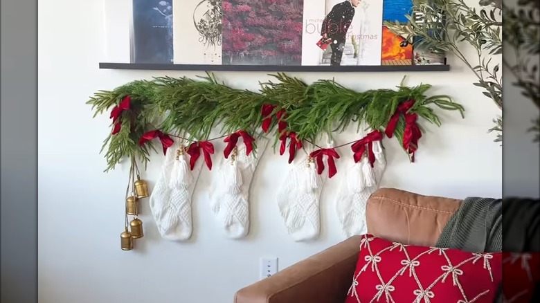 A broom handle stocking holder made from Dollar Tree items