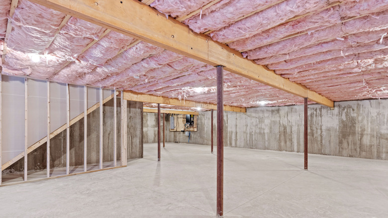 An exposed ceiling in a basement