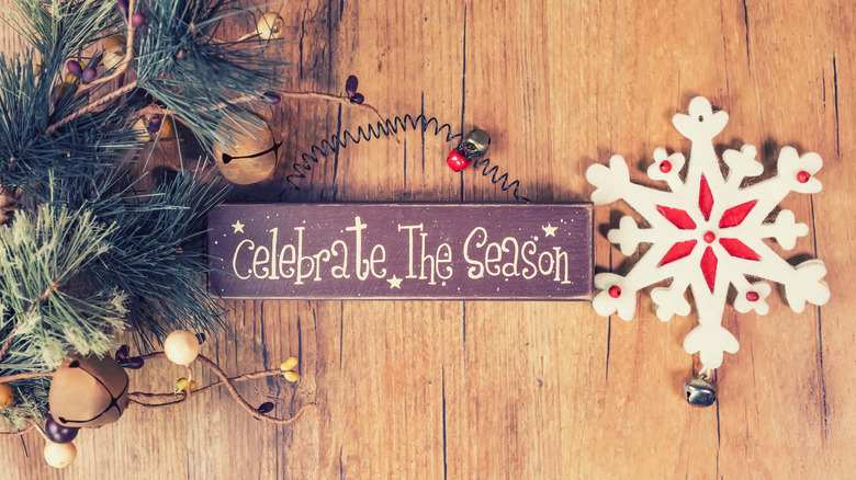 A celebrate the season sign