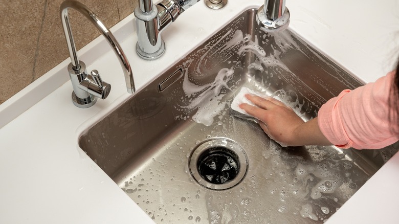hand cleaning kitchen sink
