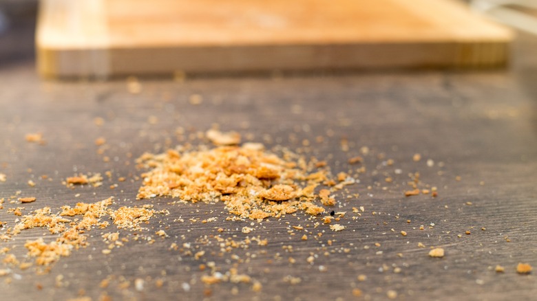 pile of crumbs on counter 