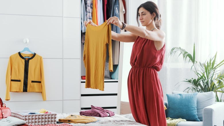 Woman decluttering closet