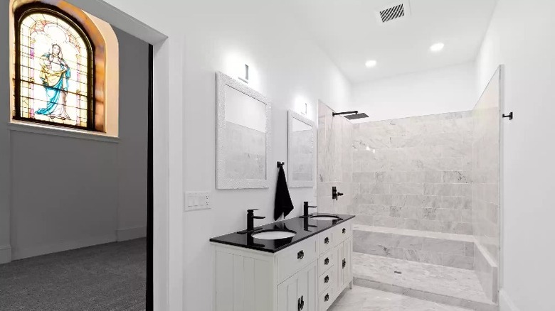White bathroom with stained glass window