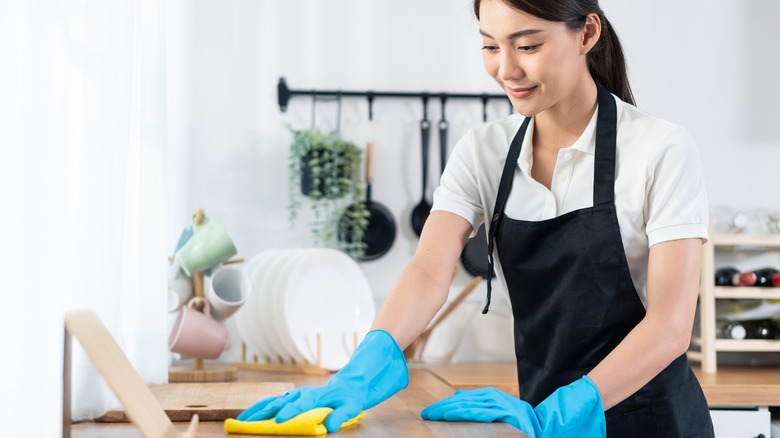 Woman cleaning countertop