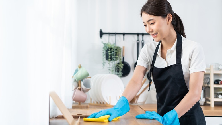 Person cleaning kitchen