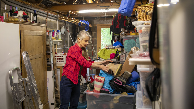 woman going through things in garage