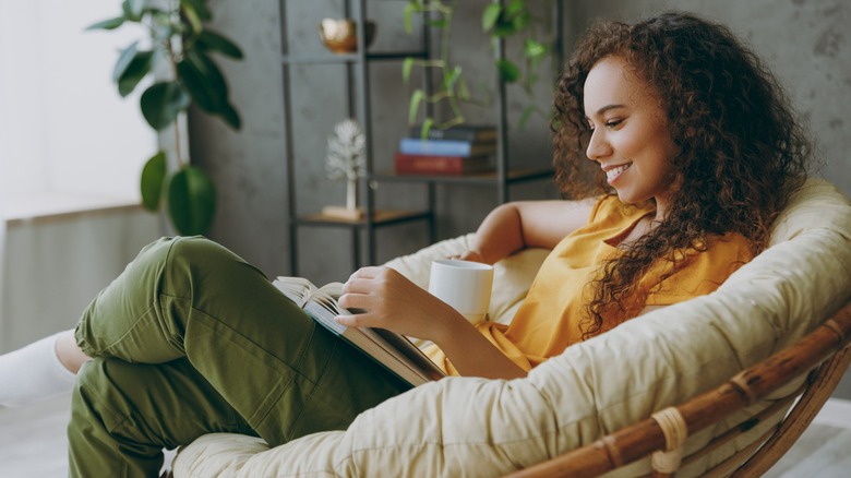 Woman reading in cozy chair