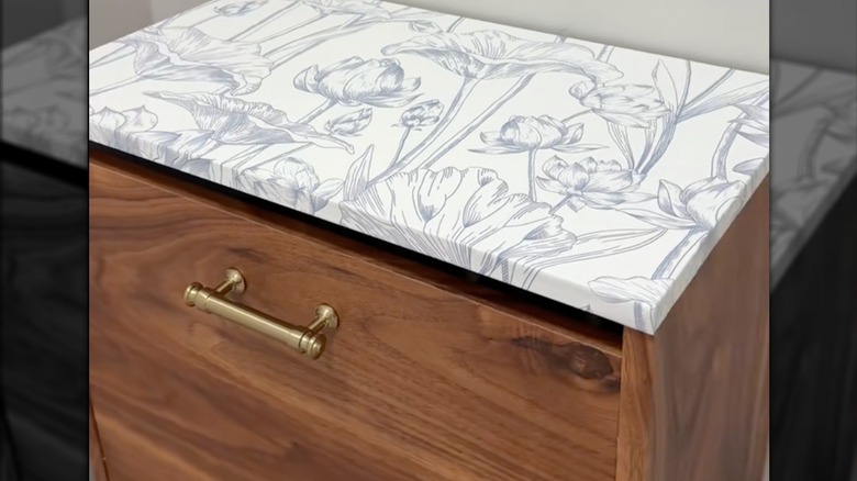 Shoe cabinet with floral and wood paneling