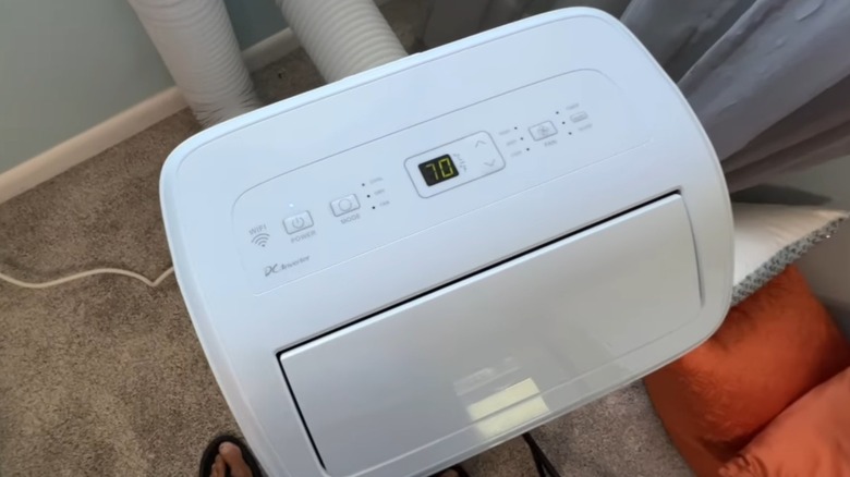 A hisense portable AC unit installed in a room