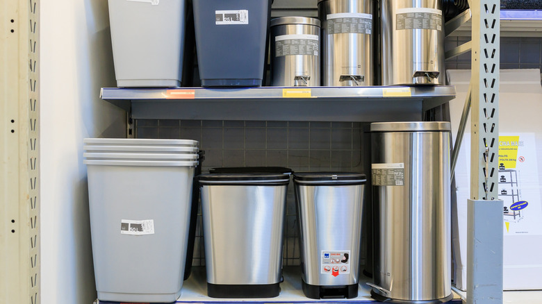 Different models of trash cans on a shelf at a store