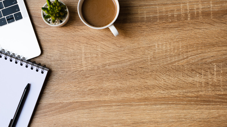 Coffee table with note pad an mug