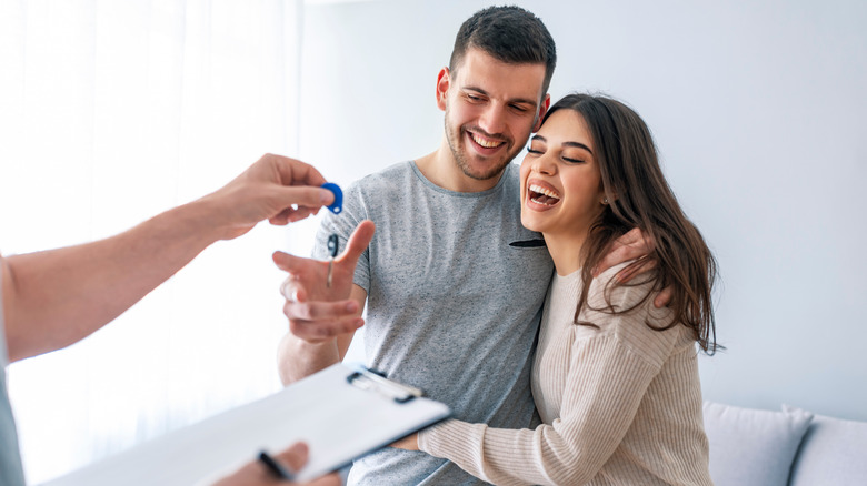 Happy couple buying a home