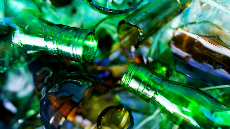 Broken green glass bottles.