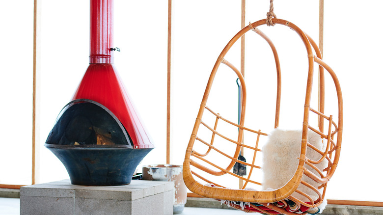 red Malm fireplace near wicker chair