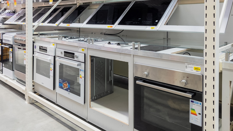 Ovens and cooktops on display at a store