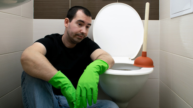 Man near toilet