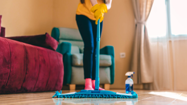 Woman mopping hardwood floor