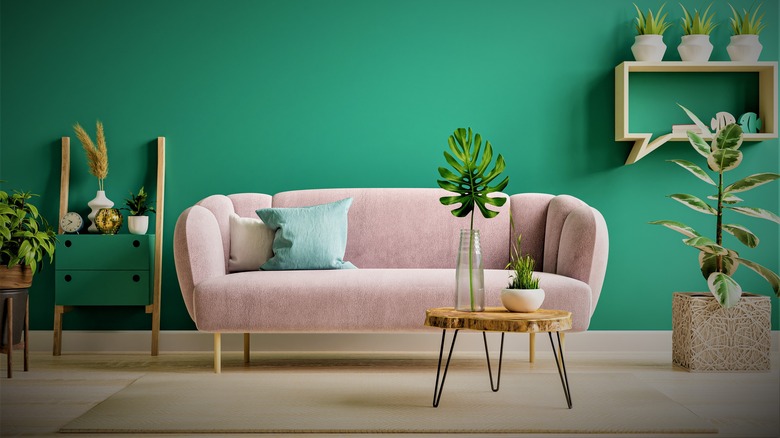 Pink couch in green room