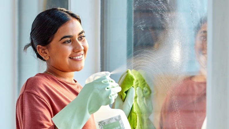 Woman cleaning windows