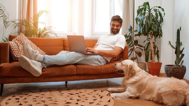 Man sitting on leather couch