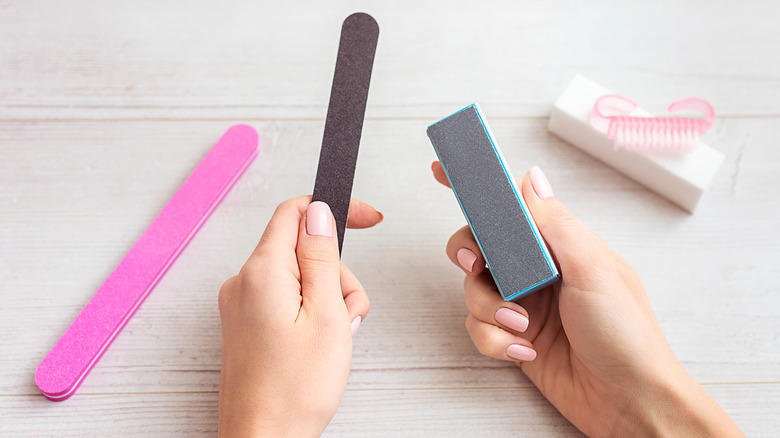 Woman holding nail file