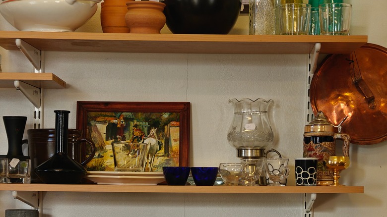 Thrifted and vintage items on kitchen shelves