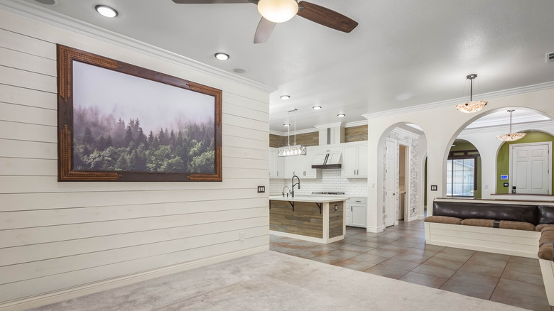 Shiplap entryway next to kitchen with banquette