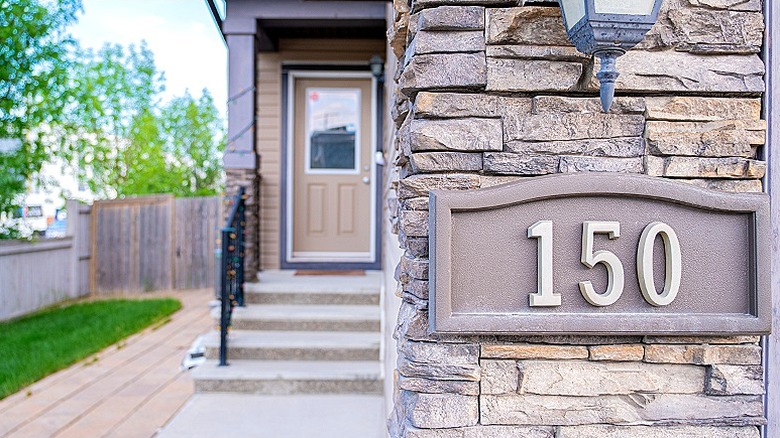Home exterior with house number plaque