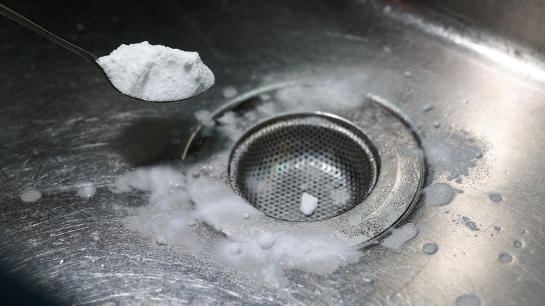 Clumpin baking soda being used to clean a sink