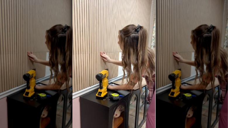 Renter installs wood panel boards to the wall to create a cozy accent wall behind her breakfast bar.