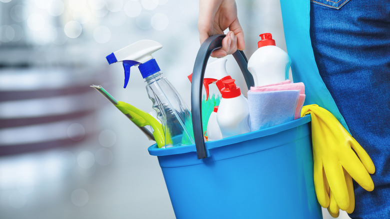 cleaning products in bucket 