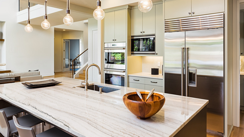 A tidy kitchen with a spotless refrigerator