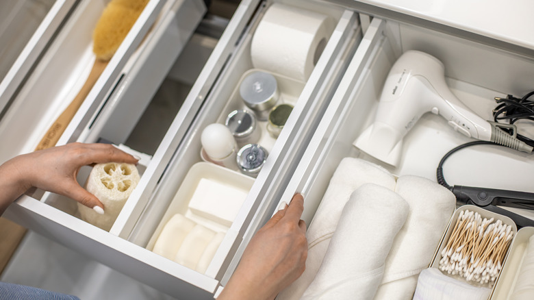 Person organizing drawer