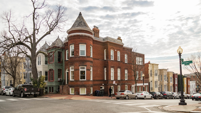 A row of nice homes and cars line Prospect Street in Washington D.C.'s Georgetown neighborhood.