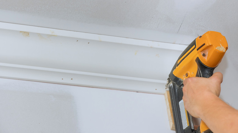 nail gun on wood trim