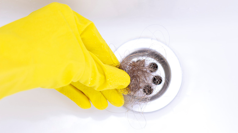 bathtub drain clogged with hair