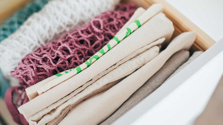 Reusable bags file folded in a container