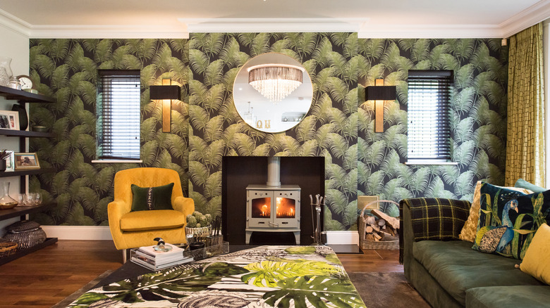 Wallpaper with palm leaves on living room wall