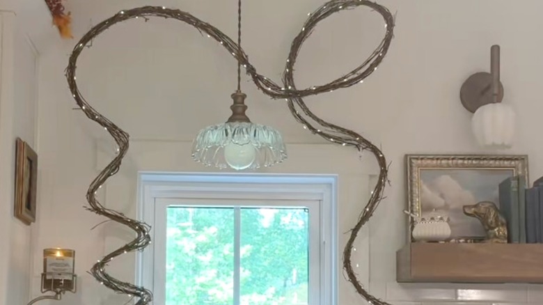 A minimalist garland hung over window made of vines