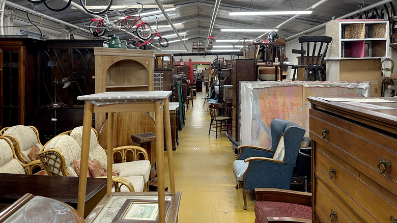 An aisle of a thrift store.