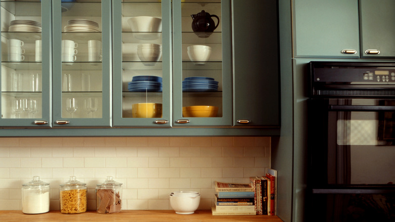 Classic kitchen with glass-front cabinets showcasing organized dishware